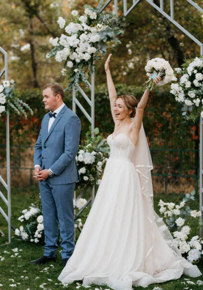 wedding ceremony of the newlyweds on the glade near the restaurant